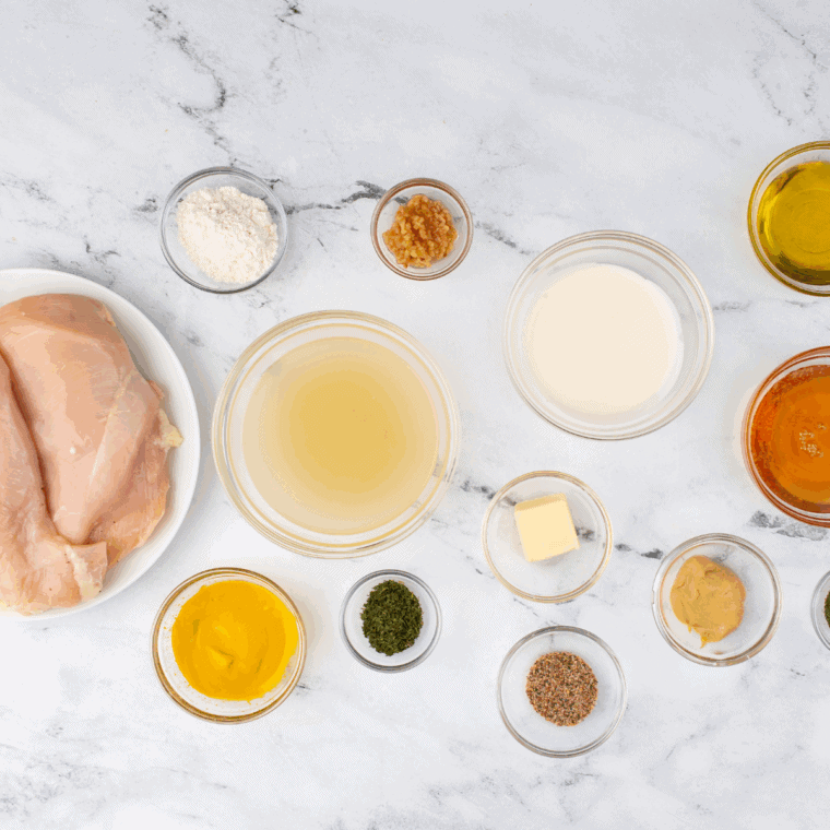 Ingredients needed for Easy Copycat Cheddar’s Dijon Chicken and Mushrooms on kitchen table.