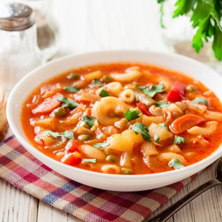 Instant Pot Olive Garden minestrone soup with vegetables, beans, pasta, and tomato broth in bowl