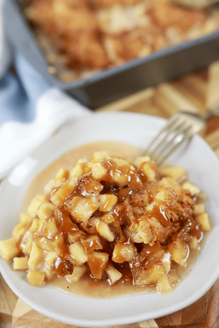 Warm air fryer apple cobbler with soft apples and golden crispy topping in a baking dish.