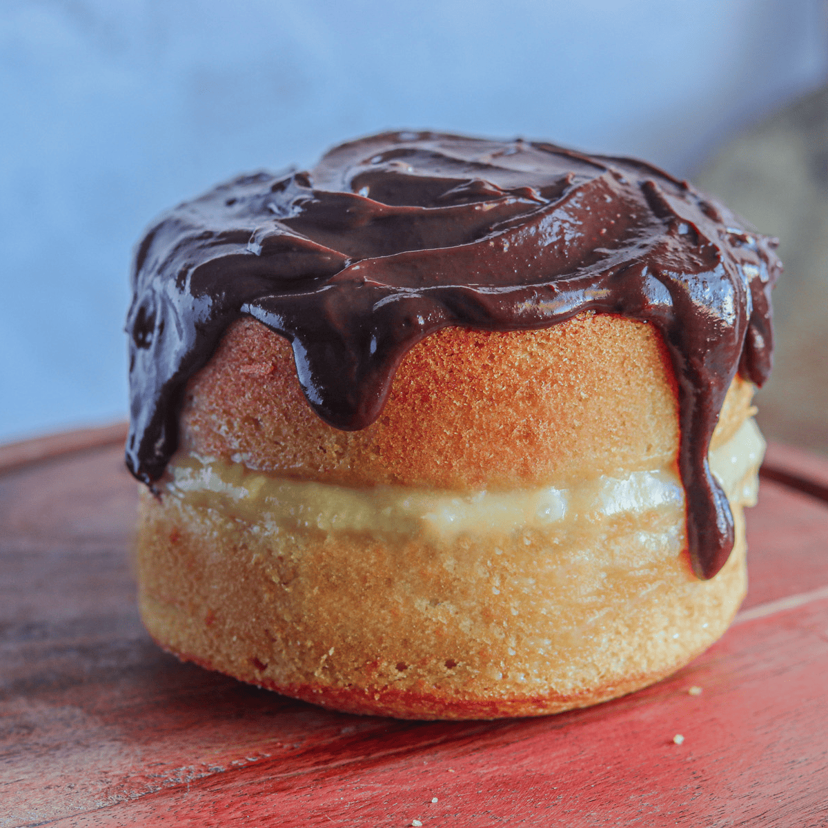 Crafting a Boston Cream Pie in an air fryer using ramekins requires a touch of finesse. Here are some pro tips to ensure perfection: Even Distribution: Ensure the batter is evenly distributed among the ramekins to promote consistent cooking. Preheat the Air Fryer: Just like a conventional oven, preheating your air fryer can make a significant difference in the end result. It ensures a consistent temperature from the start of the baking process. Space Out Ramekins: Place the ramekins in the air fryer basket ensuring there's enough space between them. This allows for better air circulation, ensuring even cooking. Monitor Cooking Time: Since air fryers can cook faster than traditional ovens, it's crucial to regularly check your pies to prevent overbaking. A toothpick inserted in the center should come out clean when it's done. Temperature Check: Air fryers can sometimes be hotter than their settings suggest. If you have an oven thermometer, place it inside to double-check the actual temperature. Cooling is Key: Once cooked, let the mini pies cool in the ramekins for a few minutes before transferring them to a cooling rack. This helps set the structure and makes filling them easier. Piping the Cream: When it's time to add the cream, using a piping bag will give you more control and a neater finish. Enjoy your air-fried Boston Cream Pie with all its luscious layers!