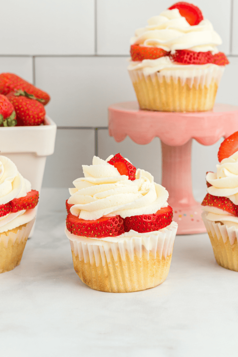 Golden, fluffy Air Fryer Homemade Yellow Cupcakes cooling on a wire rack, ready to serve.