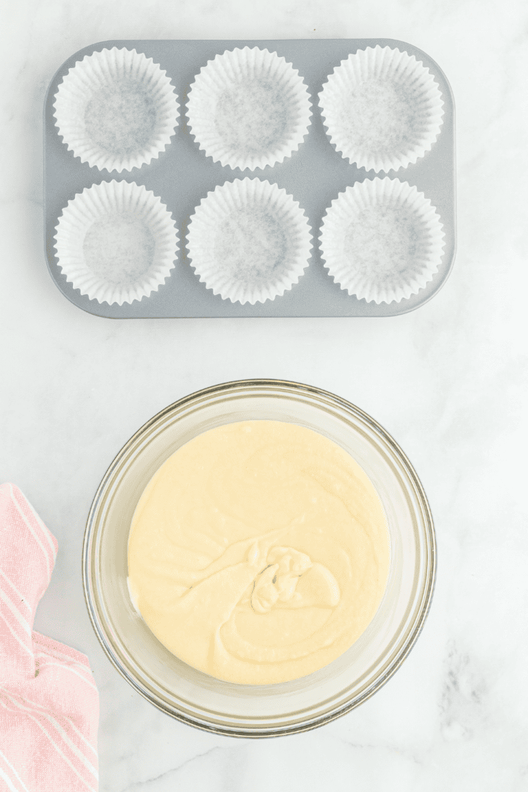 Prepare the Muffin Tin – Lining air fryer-safe muffin tin with cupcake liners or lightly greasing each cup.