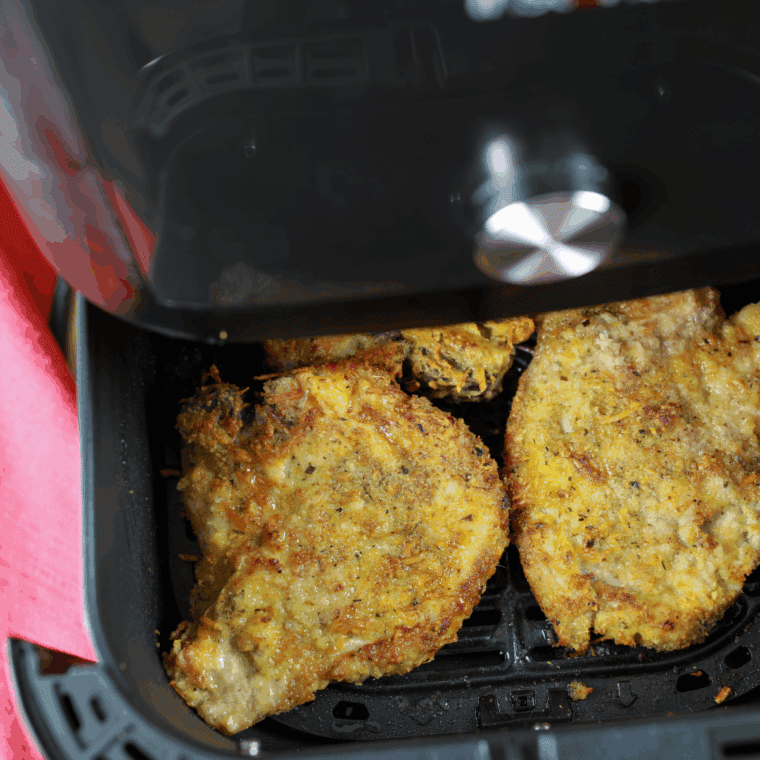 Air frying breaded pork chops until golden cooked