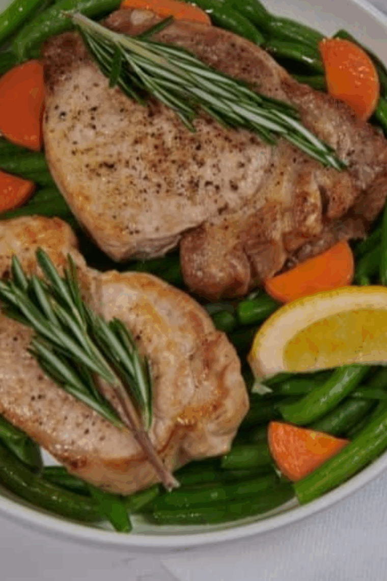 Air Fryer Blackened Pork Chops with crispy spice-coated exterior, served with sides.