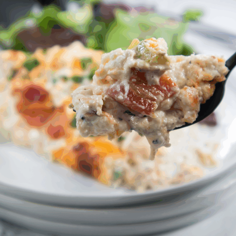Air Fryer Jalapeño Popper Stuffed Chicken served with garnish and side salad.