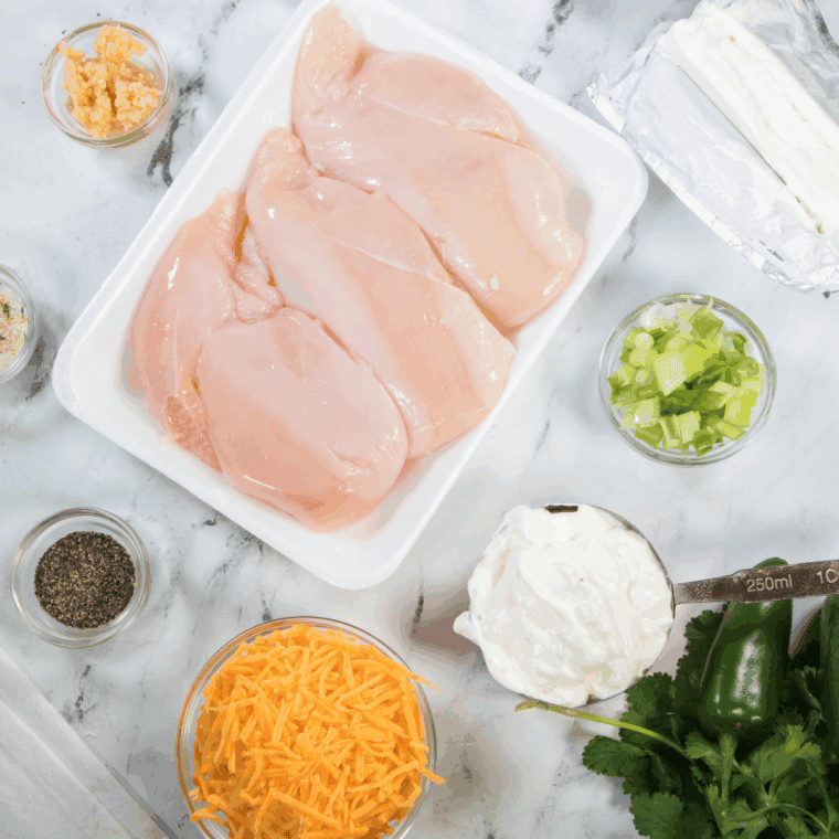 Ingredients needed for Easy Air Fryer Jalapeno Popper Stuffed Chicken on kitchen table.