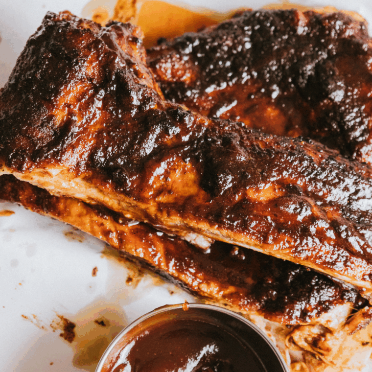 Air fryer Chili’s Baby Back Ribs coated in sticky homemade BBQ sauce, served on a plate.