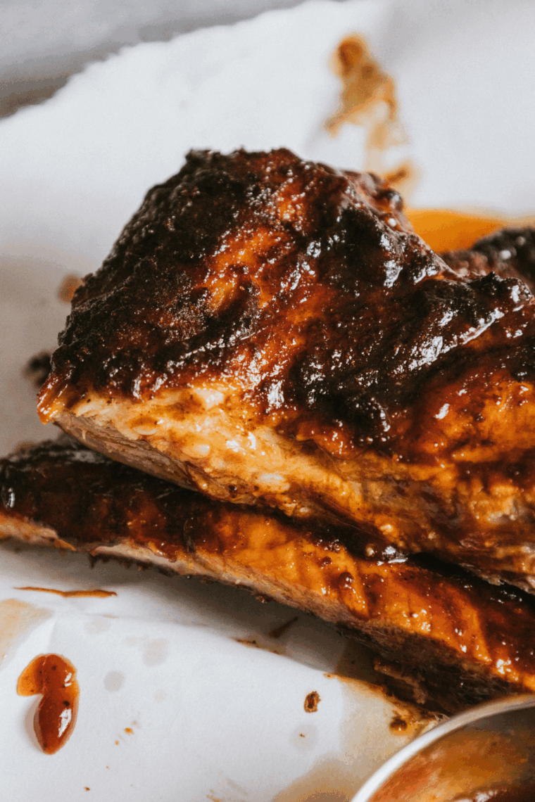 Air fryer Chili’s Baby Back Ribs glazed with tangy BBQ sauce served on a platter.