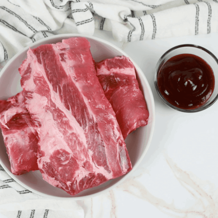 Ingredients needed for Chili’s Baby Back Ribs on kitchen table.