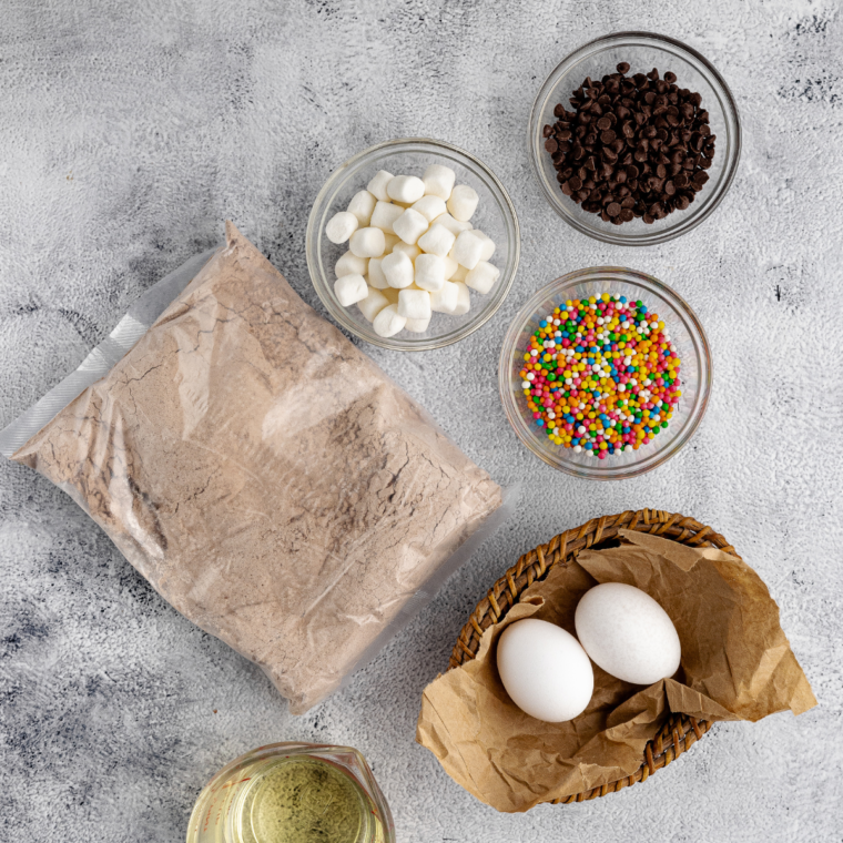 Ingredients needed for Homemade Cosmic Brownies on kitchen table.