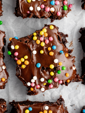 Homemade cosmic brownies with chocolate ganache and colorful candy-coated chocolate chips.