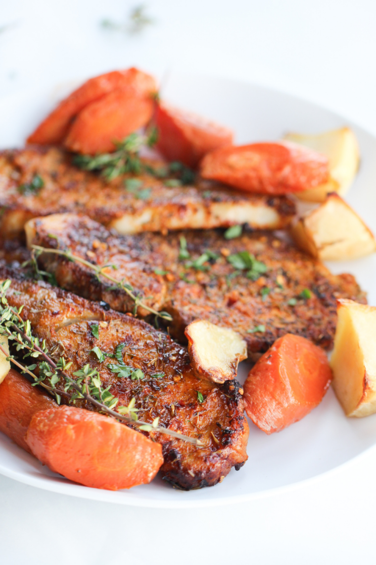 Golden-brown air fryer pork steaks on a plate, ready to serve