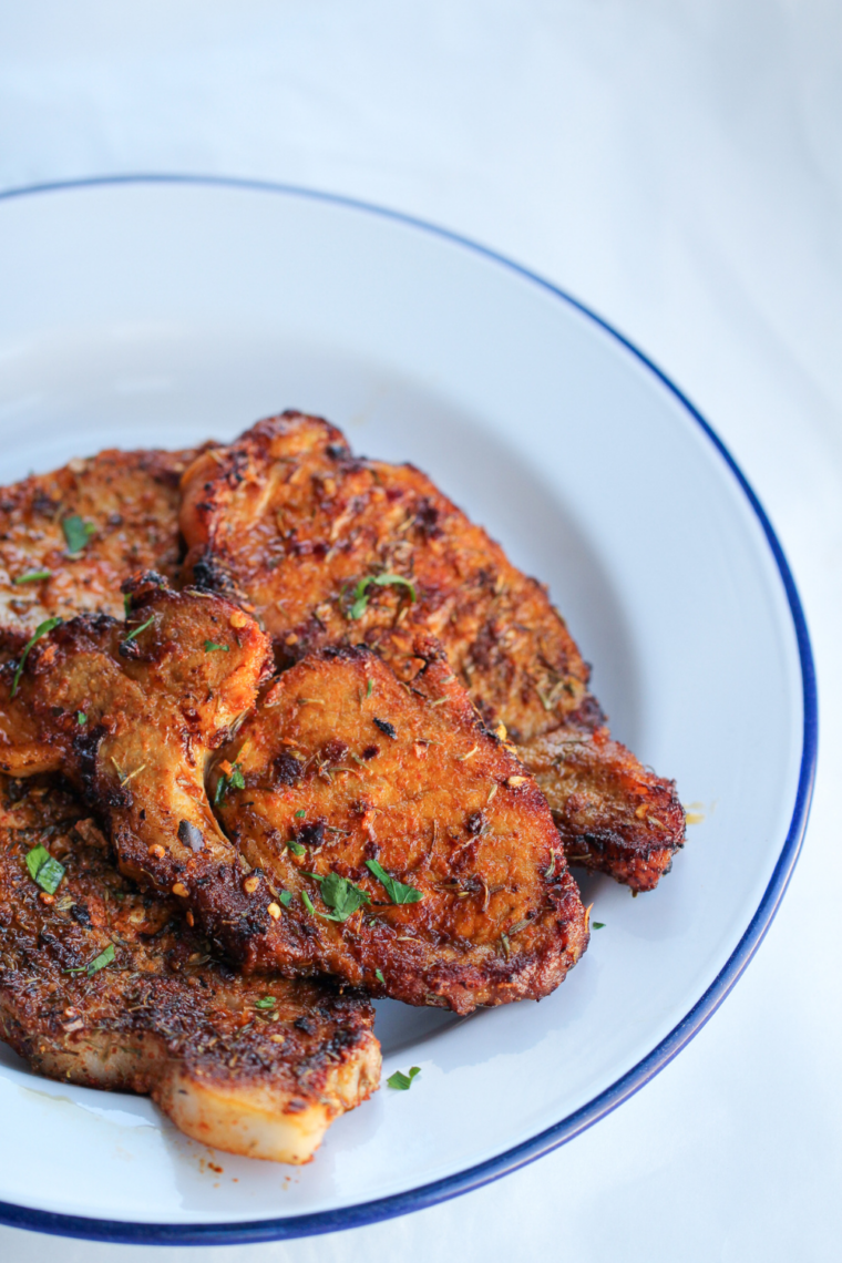 Air fryer pork steaks cooked golden-brown and plated, ready to serve