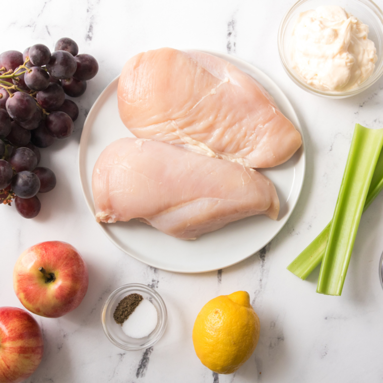 Ingredients needed for Wendy’s Apple Pecan Salad with Chicken Copycat Recipe on kitchen table.