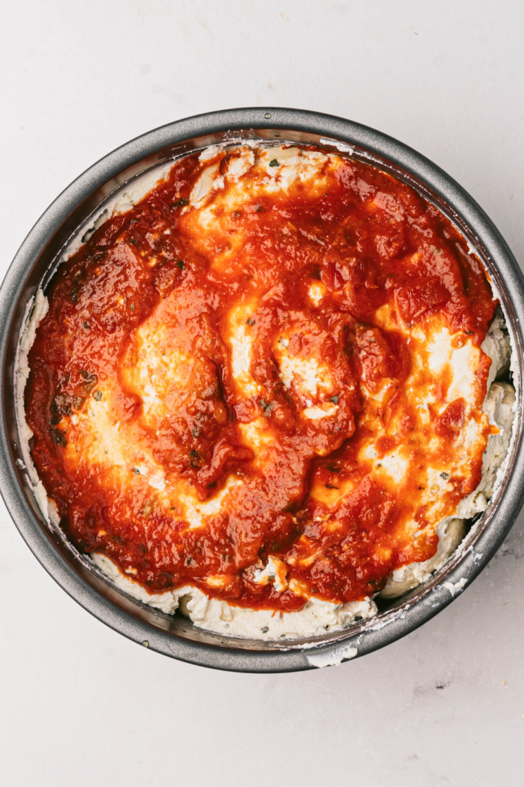 Biscuit dough mixed with pizza sauce mozzarella and seasonings