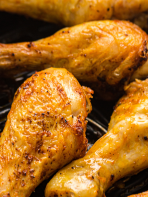 Garlic paprika chicken drumsticks on a white plate
