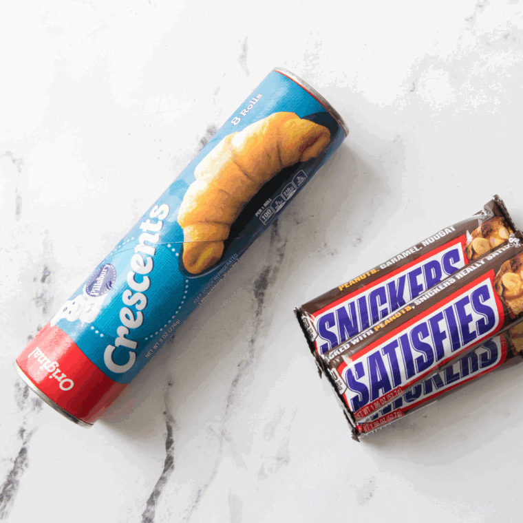 Ingredients needed for Air Fryer Snickers Bars on kitchen table.