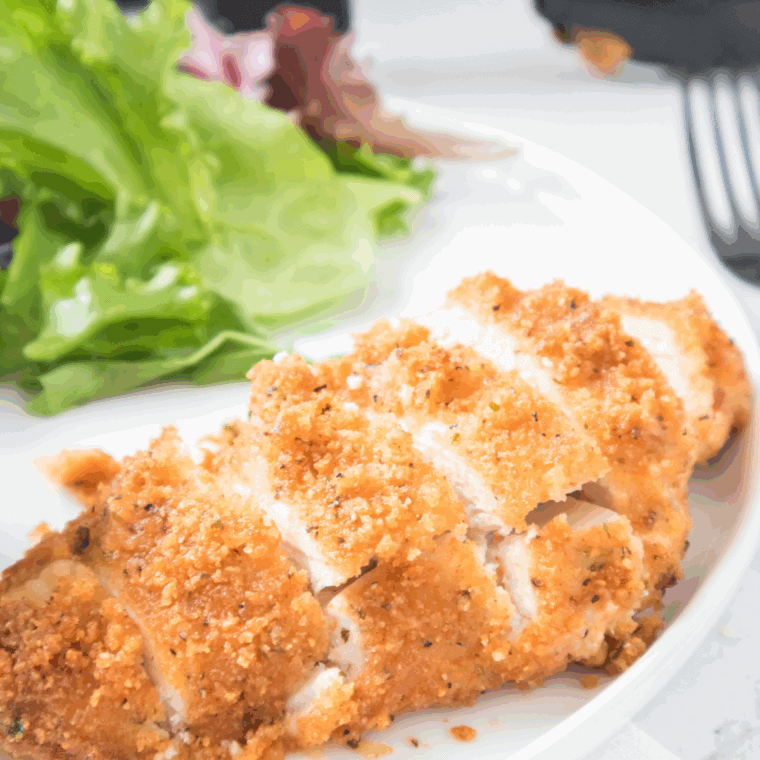 Parmesan crusted chicken topped with fresh arugula and lemon vinaigrette, Carrabba’s restaurant-style.