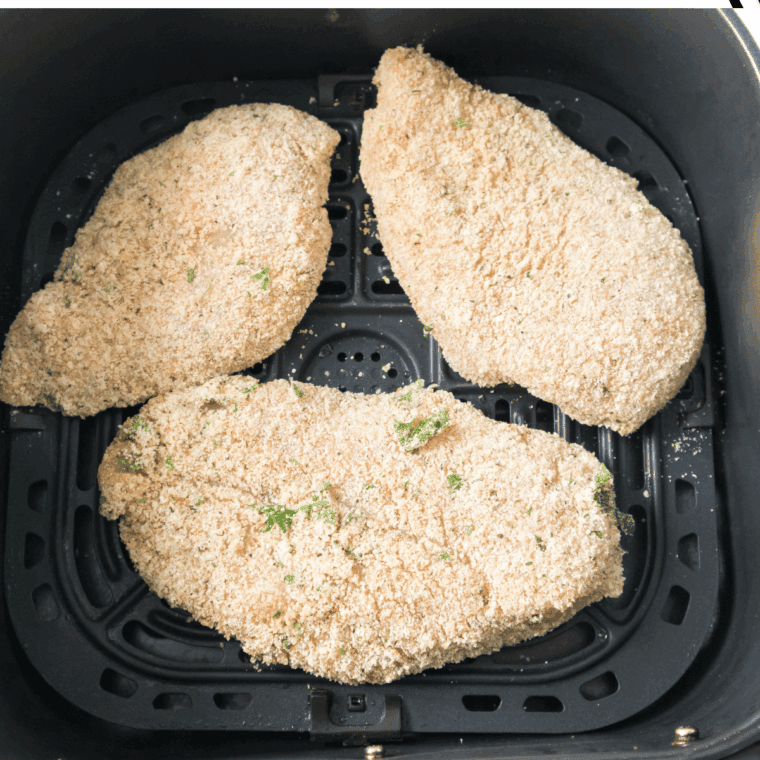 Place Carrabba’s Parmesan Crusted Chicken Arugula Recipe in the air fryer basket.