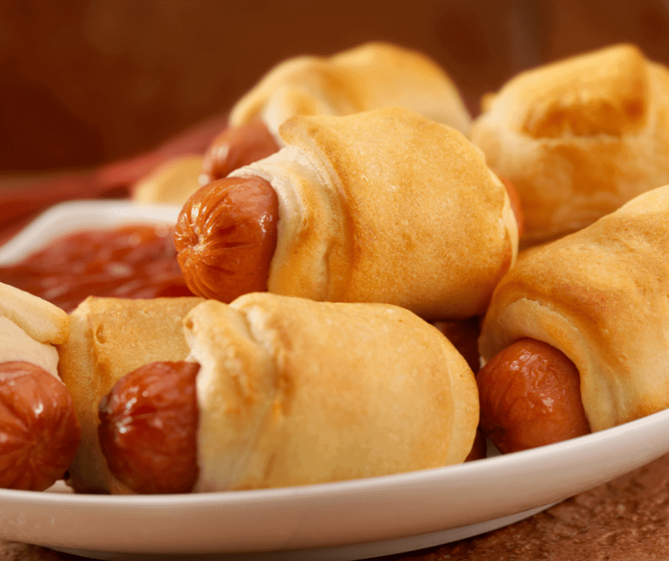 pigs in a blanket on a white plate