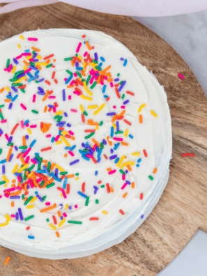 Slice of air fryer birthday cake showing moist, fluffy confetti crumb on a plate