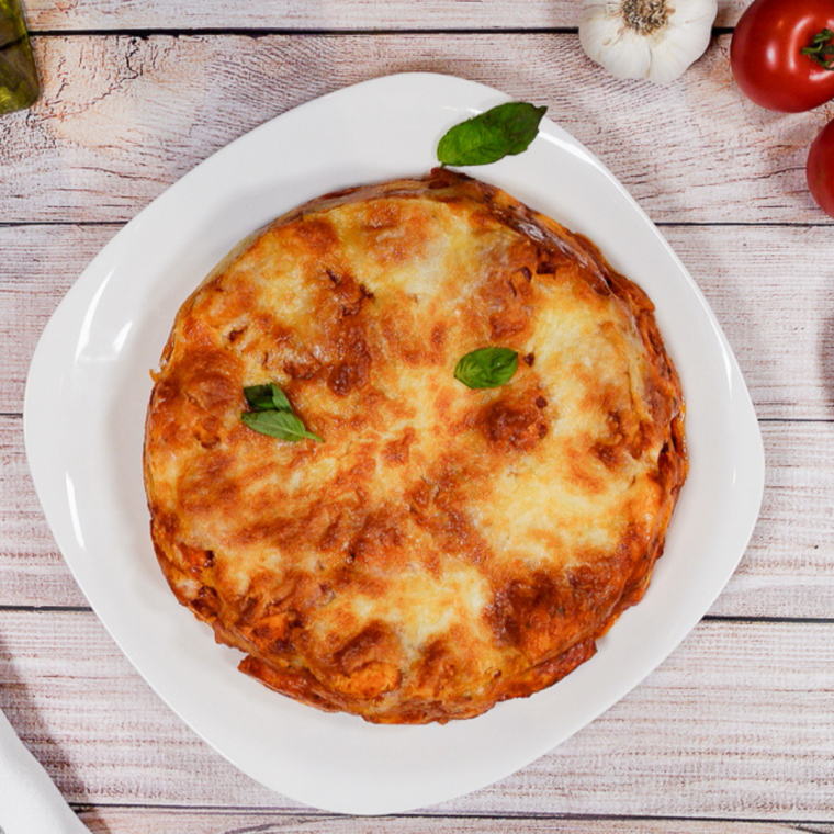 "Baked Air Fryer Pizza Casserole with golden edges and melted cheese, topped with pepperoni"