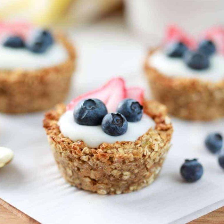 Air Fryer Oatmeal Bites on a plate with fresh fruit on the side