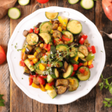 Air Fryer Squash and Zucchini -- A simple recipe that you can use summer's fresh zucchini and some yellow summer squash for a fantastic side dish! If you have been looking for an easy air fryer zucchini and summer squash recipe, this is the perfect way to cook this healthy veggie side dish!