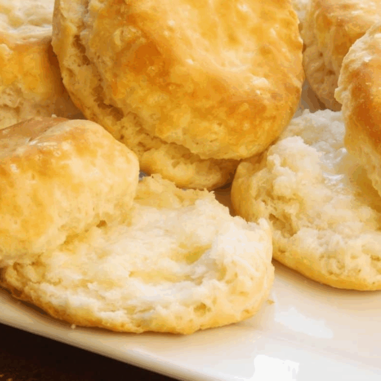 Golden, fluffy biscuits served warm with butter, jam, or gravy