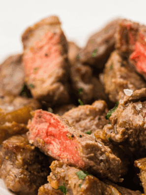 Tender bourbon marinated steak tips cooked until juicy and caramelized