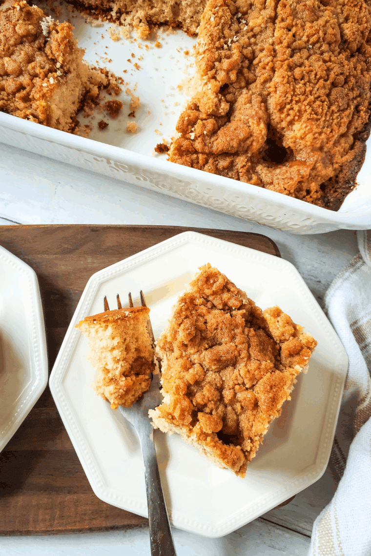 Easy yellow cake mix coffee cake with golden cinnamon-sugar crumb topping served on a plate.