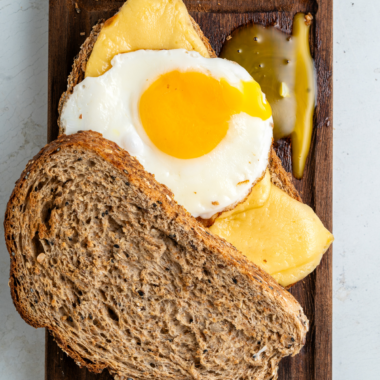 Ninja Crispi fried eggs with crispy lacy brown edges and a runny yolk in the glass container
