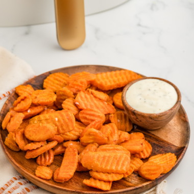 A plate of crispy Air Fryer Carrot Chips, showcasing perfectly air-fried carrots with tender centers and crispy edges, ideal for a tasty side dish or snack.