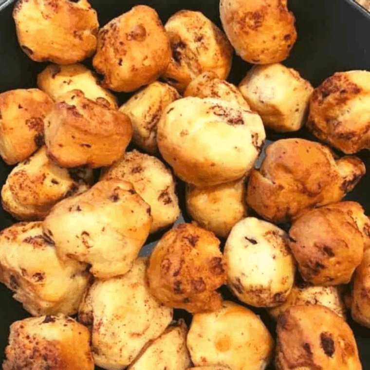 Air Fryer Cinnamon Roll Bubble Bites, golden brown and drizzled with sweet glaze.
