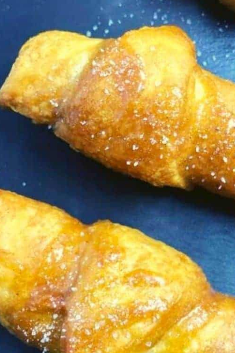 Air Fryer Pumpkin Pie Crescent Rolls on plate, close up.