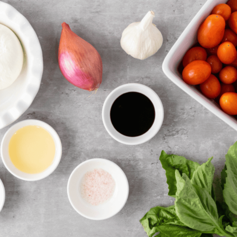 Ingredients needed for Copycat Olive Garden Bruschetta on kitchen table.