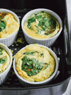 Air Fryer Spinach and Tomato Frittata with fresh spinach, cherry tomatoes, and melted cheese in a golden, fluffy frittata cooked in the air fryer.
