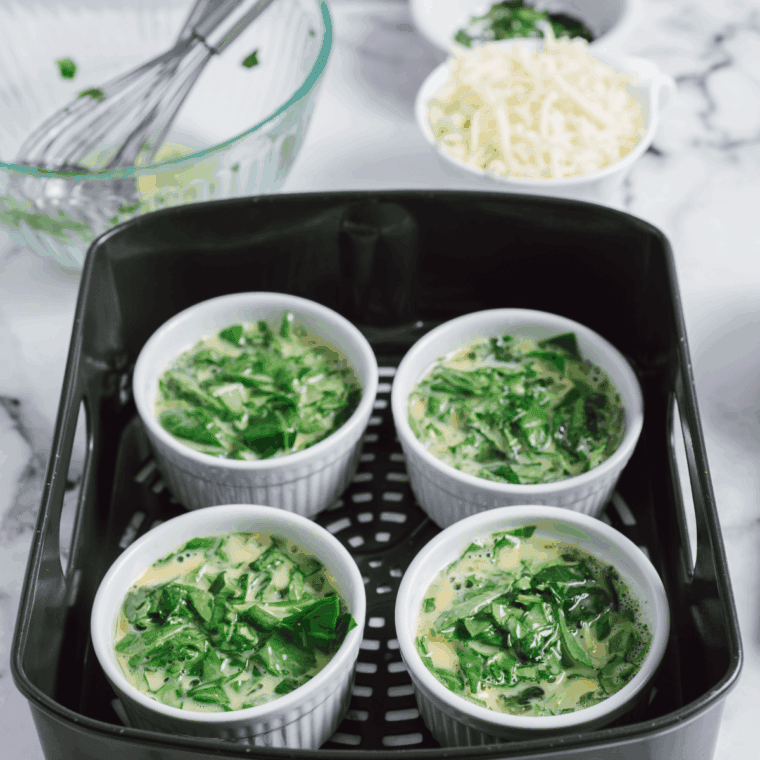 Arrange ramekins in air fryer basket and cook for 5 minutes, in batches if needed.