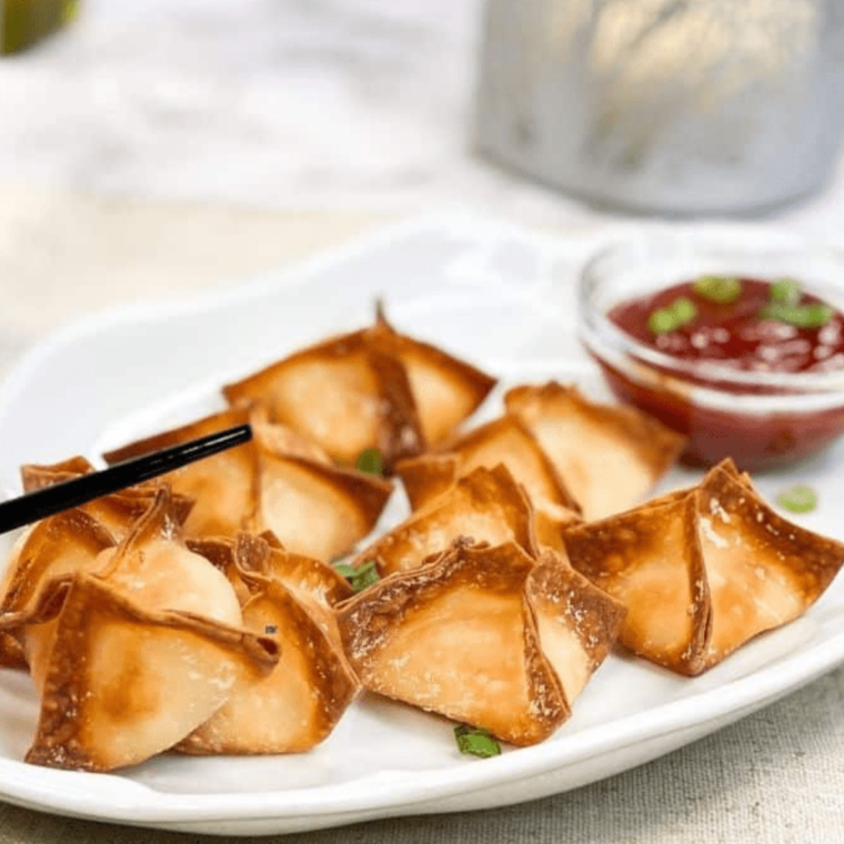 Plate of Air Fryer Crab Rangoon, with dipping sauce.