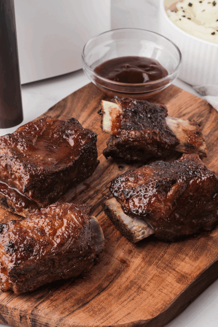 Air fryer Korean short ribs cooking to crispy, caramelized perfection.