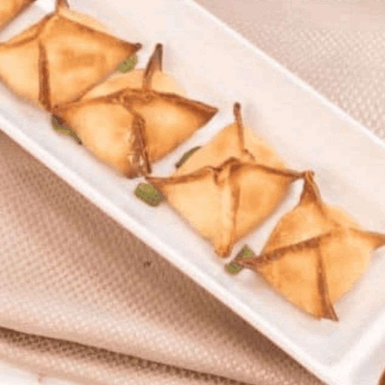 Homemade P.F. Chang’s Crab Rangoons on plate with dipping sauce.
