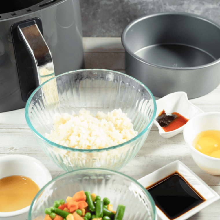Ingredients needed for Air Fryer Fried Cauliflower Rice on kitchen table.