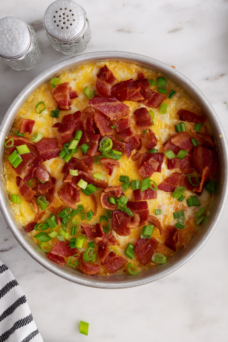 Creamy air fryer mashed potatoes in a bowl with butter melting into fluffy texture easy no-boil comfort food side dish recipe.