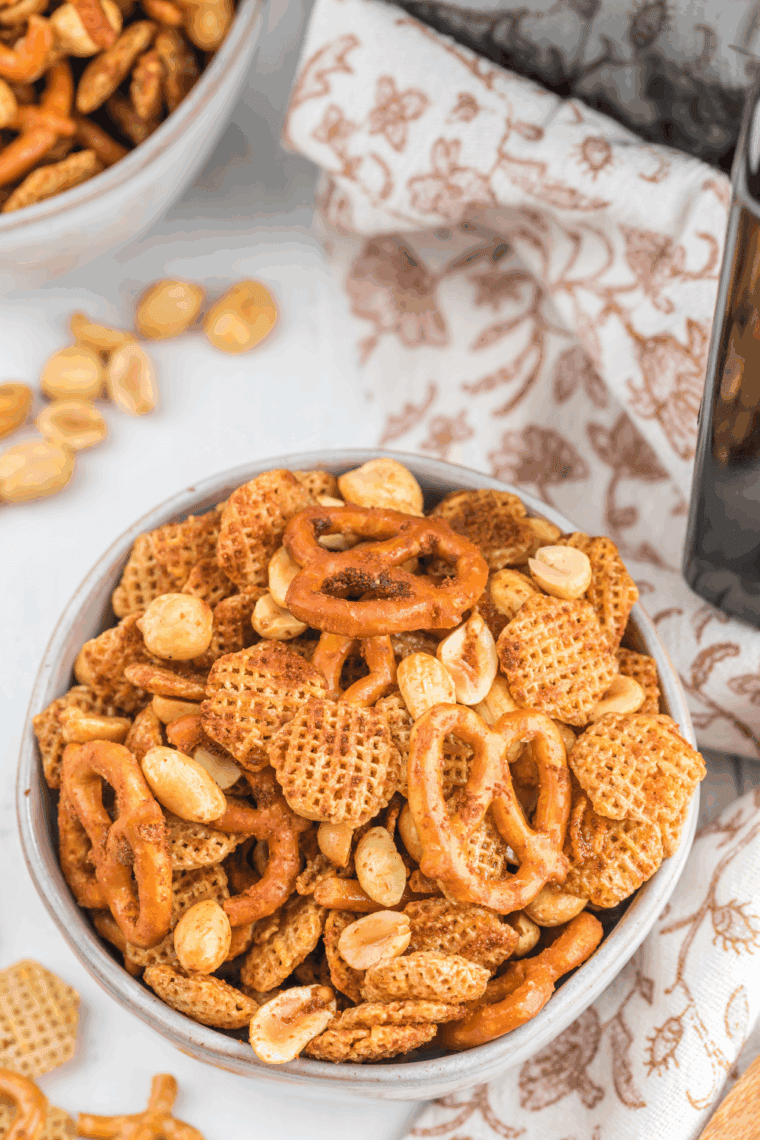 Air fryer Chex Mix with cereal, pretzels, and nuts in bowl