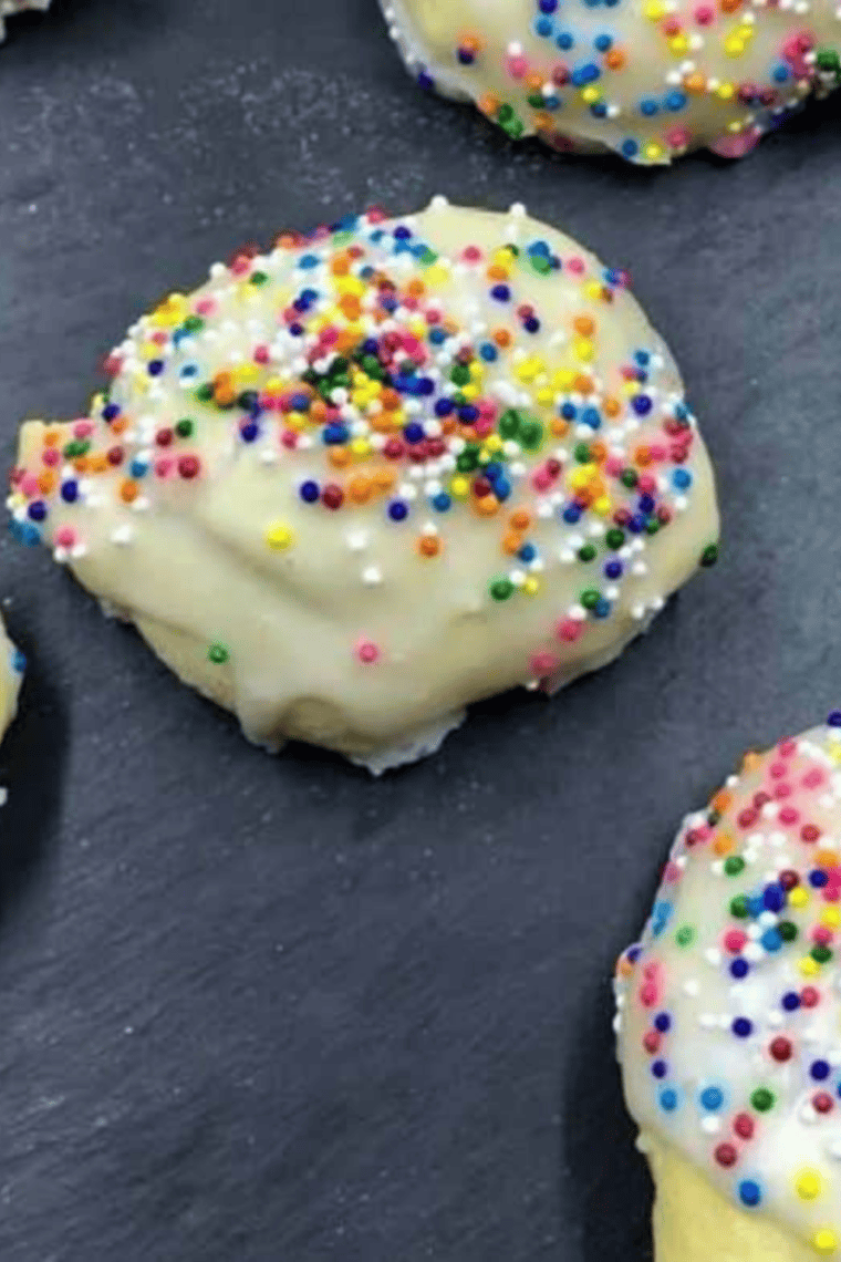 Soft and chewy air fryer Italian cookies stacked on a cooling rack with almond and citrus flavor