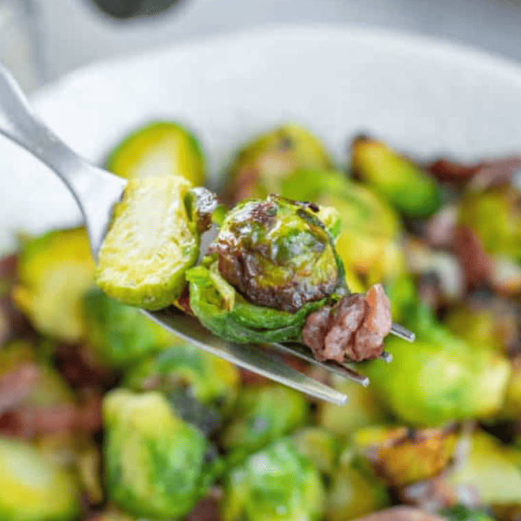 Longhorn Steakhouse crispy Brussels sprouts with a golden, crunchy exterior and tender inside, served with a savory glaze.