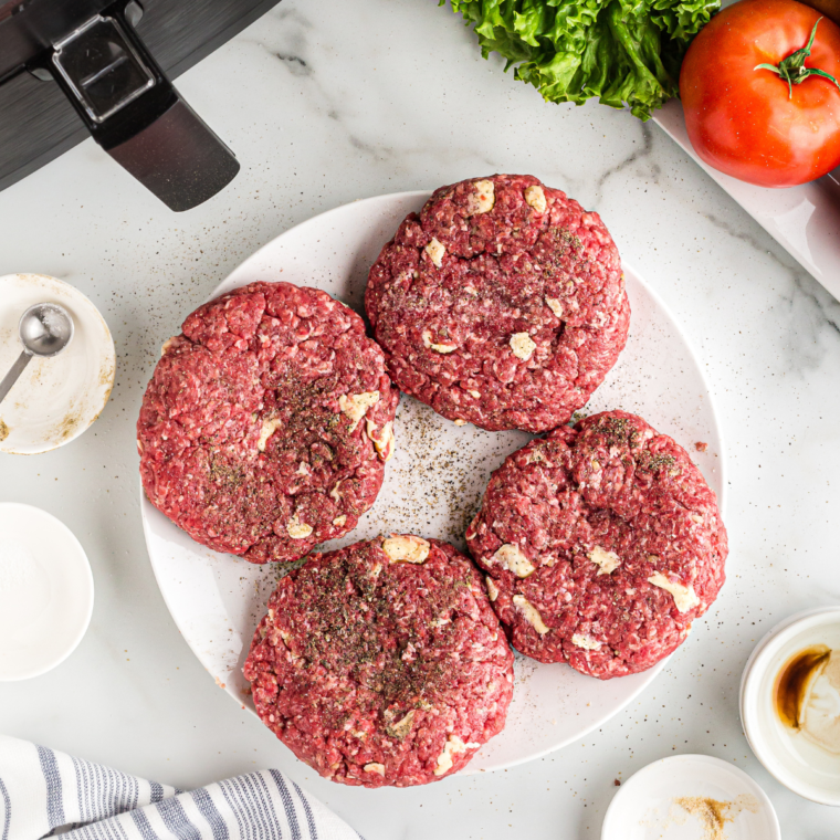 Ground beef being formed into burger patties for air fryer bacon cheeseburgers.