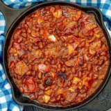 Air Fryer Baked Beans in Cast iron pan.