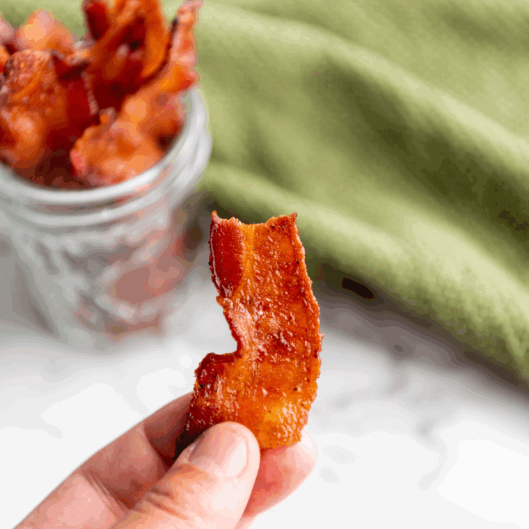 Air Fryer Bourbon Candied Bacon: Crispy bacon coated with bourbon and brown sugar glaze, air-fried to perfection for a sweet, smoky flavor.