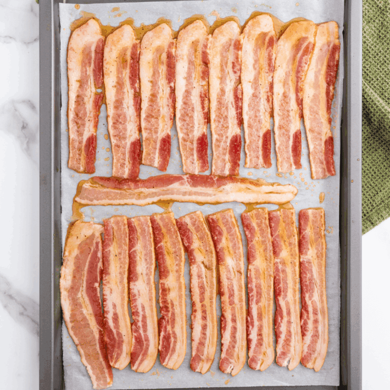 Place glazed bacon slices in the air fryer basket, cook for 8-10 minutes, flipping halfway, until golden and crispy. Let cool for a minute to set the glaze.